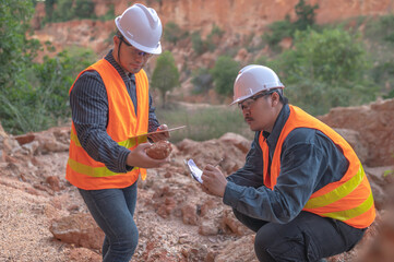 Geologist surveying mine,Explorers collect soil samples to look for minerals.