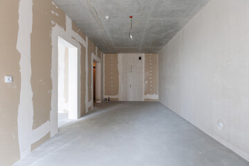 interior of the apartment without decoration in gray colors. rough finish