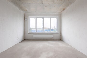 interior of the apartment without decoration in gray colors. rough finish