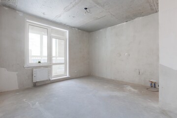 interior of the apartment without decoration in gray colors. rough finish