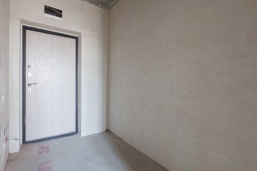 interior of the apartment without decoration in gray colors. rough finish