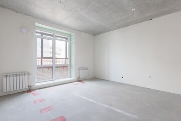 interior of the apartment without decoration in gray colors. rough finish