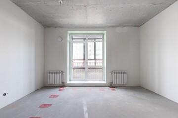 interior of the apartment without decoration in gray colors. rough finish