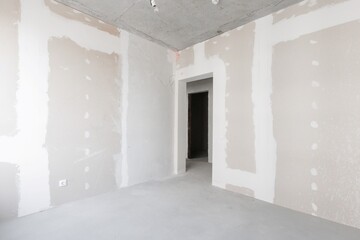 interior of the apartment without decoration in gray colors. rough finish