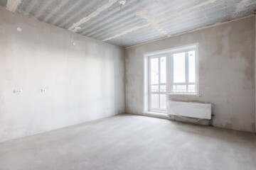 interior of the apartment without decoration in gray colors. rough finish