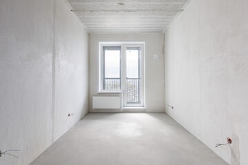 interior of the apartment without decoration in gray colors. rough finish