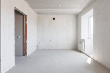 interior of the apartment without decoration in gray colors. rough finish