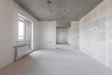 interior of the apartment without decoration in gray colors. rough finish