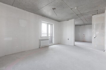 interior of the apartment without decoration in gray colors. rough finish