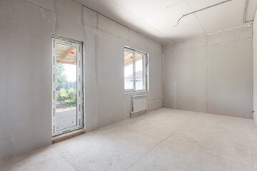 interior of the apartment without decoration in gray colors. rough finish