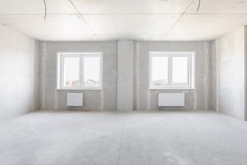 interior of the apartment without decoration in gray colors. rough finish