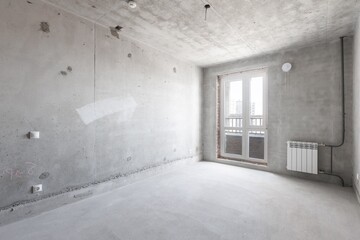 interior of the apartment without decoration in gray colors. rough finish
