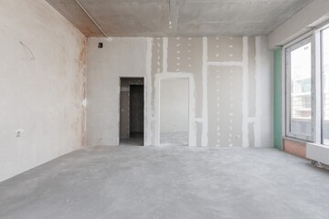 interior of the apartment without decoration in gray colors. rough finish