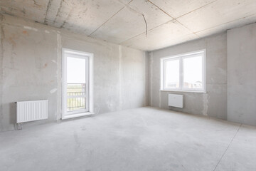 interior of the apartment without decoration in gray colors. rough finish