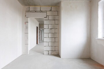 interior of the apartment without decoration in gray colors. rough finish