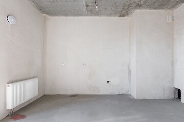 interior of the apartment without decoration in gray colors. rough finish