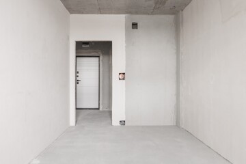 interior of the apartment without decoration in gray colors. rough finish