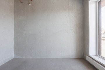 interior of the apartment without decoration in gray colors. rough finish