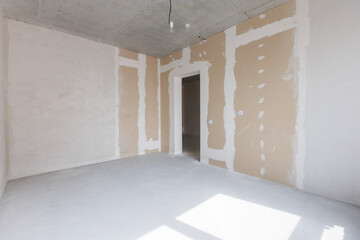 interior of the apartment without decoration in gray colors. rough finish