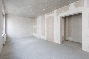 interior of the apartment without decoration in gray colors. rough finish