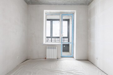interior of the apartment without decoration in gray colors. rough finish
