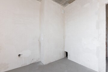 interior of the apartment without decoration in gray colors. rough finish