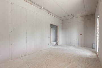 interior of the apartment without decoration in gray colors. rough finish