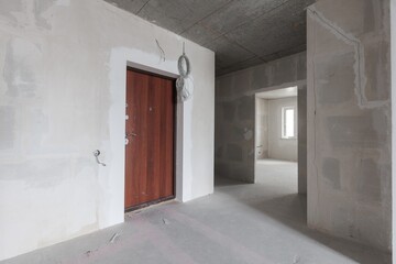interior of the apartment without decoration in gray colors. rough finish