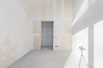 interior of the apartment without decoration in gray colors. rough finish