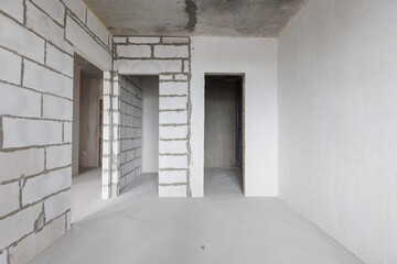 interior of the apartment without decoration in gray colors. rough finish