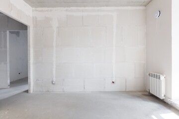 interior of the apartment without decoration in gray colors. rough finish