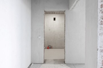 interior of the apartment without decoration in gray colors. rough finish
