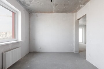 interior of the apartment without decoration in gray colors. rough finish