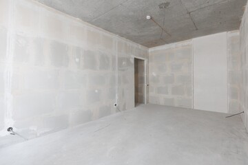 interior of the apartment without decoration in gray colors. rough finish