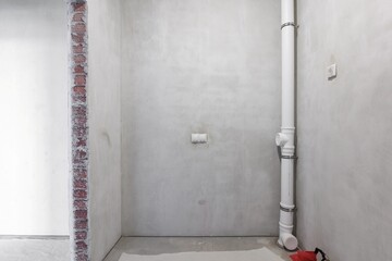 interior of the apartment without decoration in gray colors. rough finish