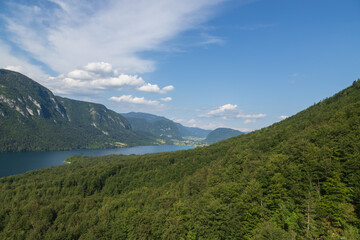 Fototapeta na wymiar Lake Bohinj a large lake in Slovenia, is located in the Bohinj Valley of the Julian Alps, in the northwestern region of Upper Carniola, part of the Triglav National Park