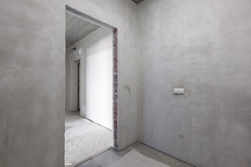 interior of the apartment without decoration in gray colors. rough finish