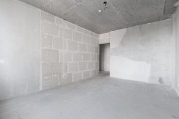 interior of the apartment without decoration in gray colors. rough finish