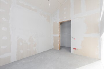 interior of the apartment without decoration in gray colors. rough finish