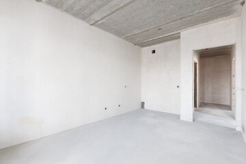 interior of the apartment without decoration in gray colors. rough finish