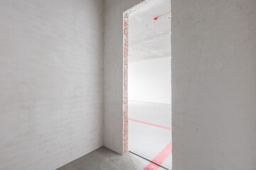 interior of the apartment without decoration in gray colors. rough finish