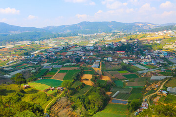 Fototapeta na wymiar Beautiful view of Da Lat city (Dalat) on the blue sky background in Vietnam
