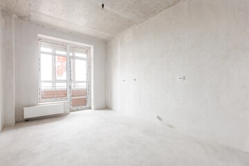 interior of the apartment without decoration in gray colors. rough finish