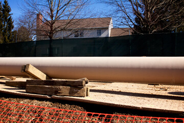 Natural gas liquids pipeline construction in a residential neighborhood using horizontal directional drilling.