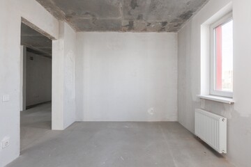 interior of the apartment without decoration in gray colors. rough finish