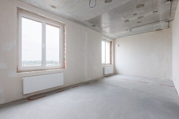 interior of the apartment without decoration in gray colors. rough finish