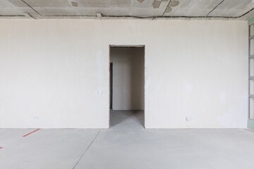 interior of the apartment without decoration in gray colors. rough finish