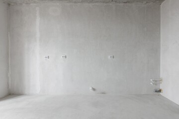 interior of the apartment without decoration in gray colors. rough finish