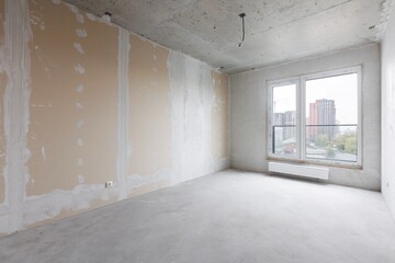 interior of the apartment without decoration in gray colors. rough finish