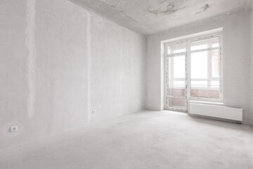 interior of the apartment without decoration in gray colors. rough finish